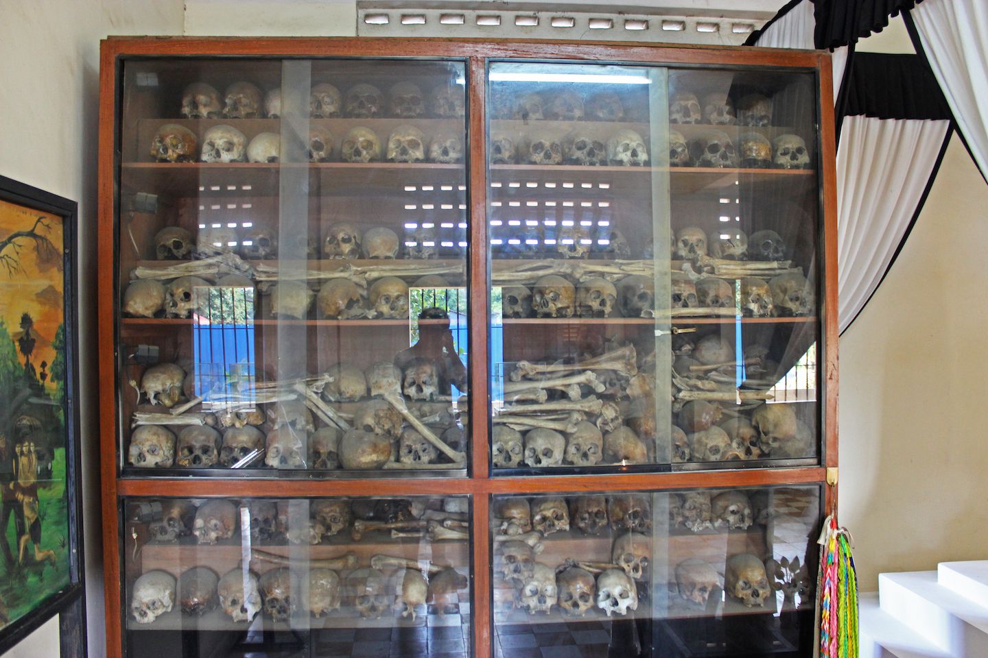 Shelves with skulls and human bones at S-21