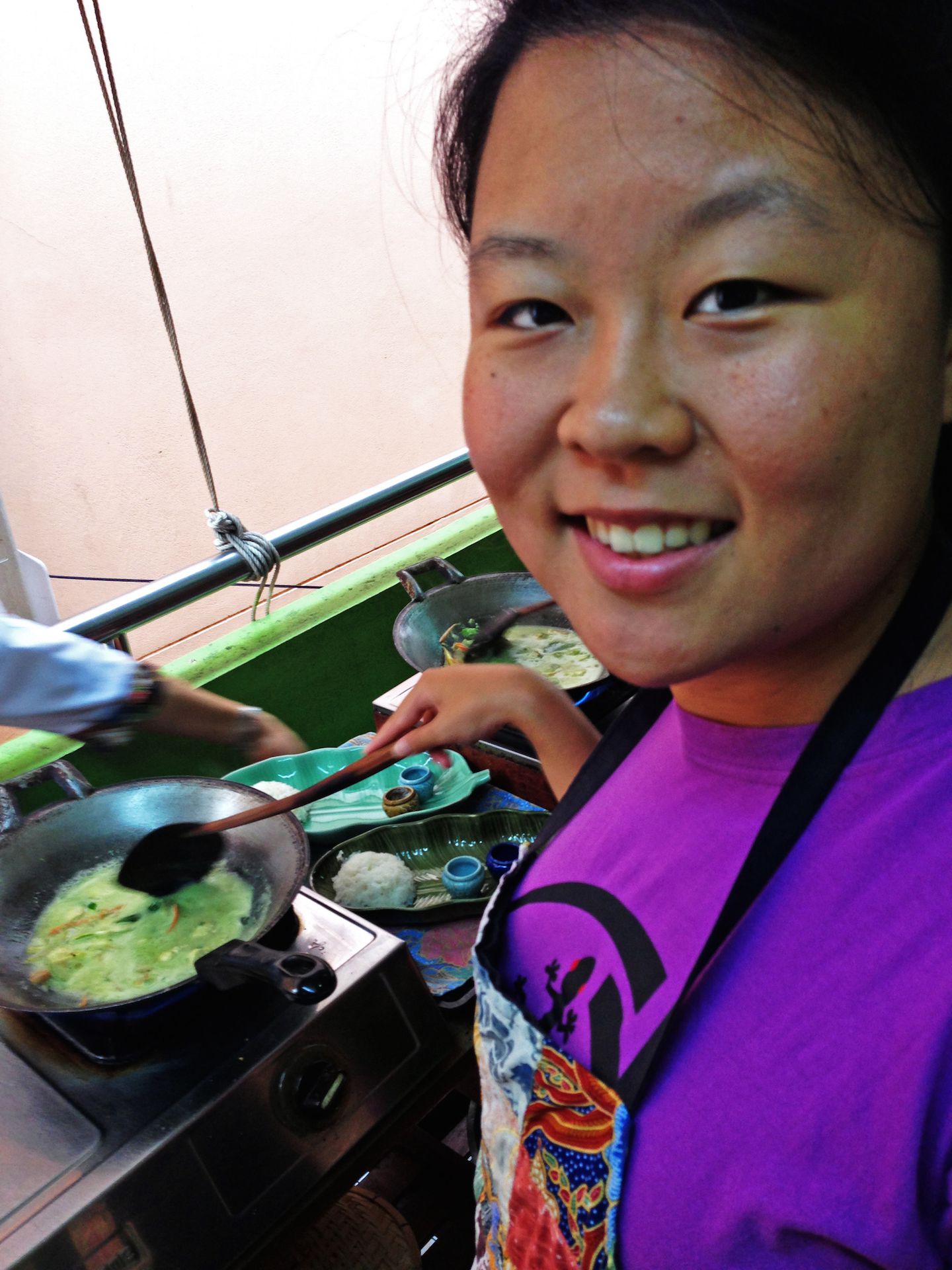 Julie cooking green curry, Silom Cooking School, Bangkok, Thailand