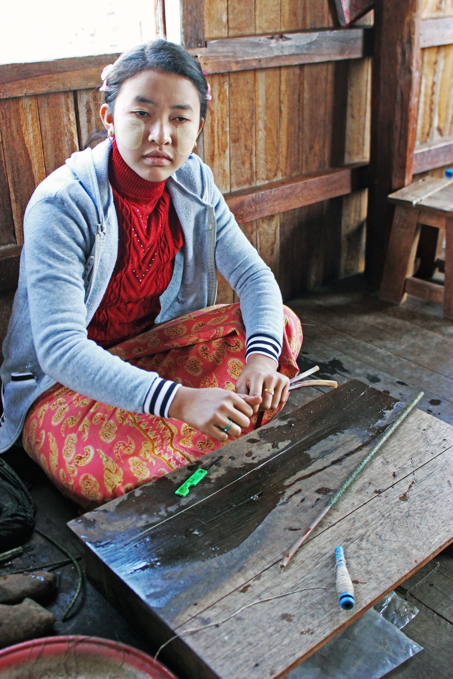 Making thread out of lotus trunks, Inle Lake, Myanmar