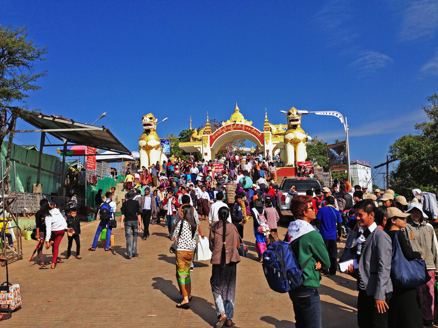 Pilgrims entering the no-shoes zone, Golden Rock, Myanmar