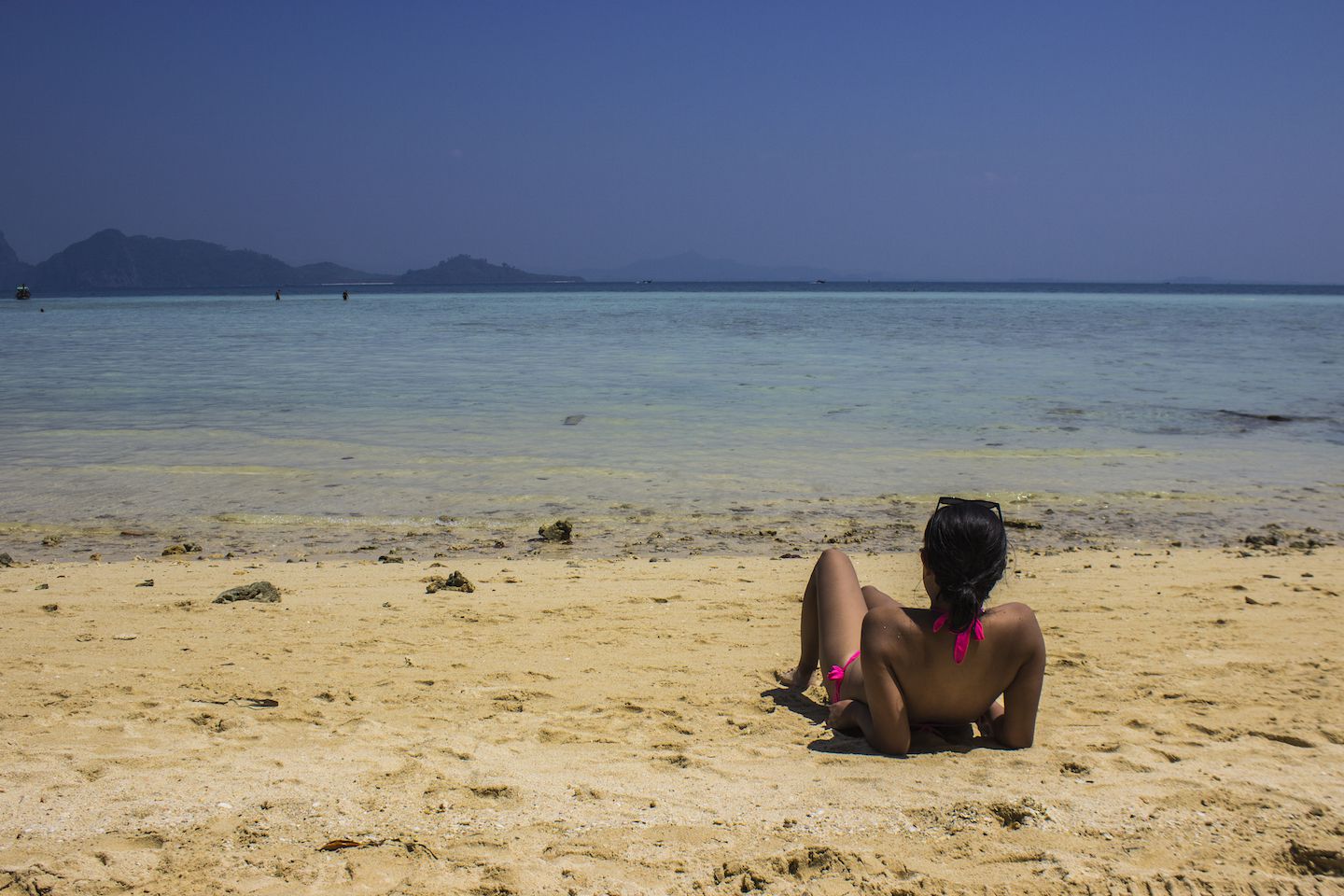 Julie lounging on the beach of Koh KRadan