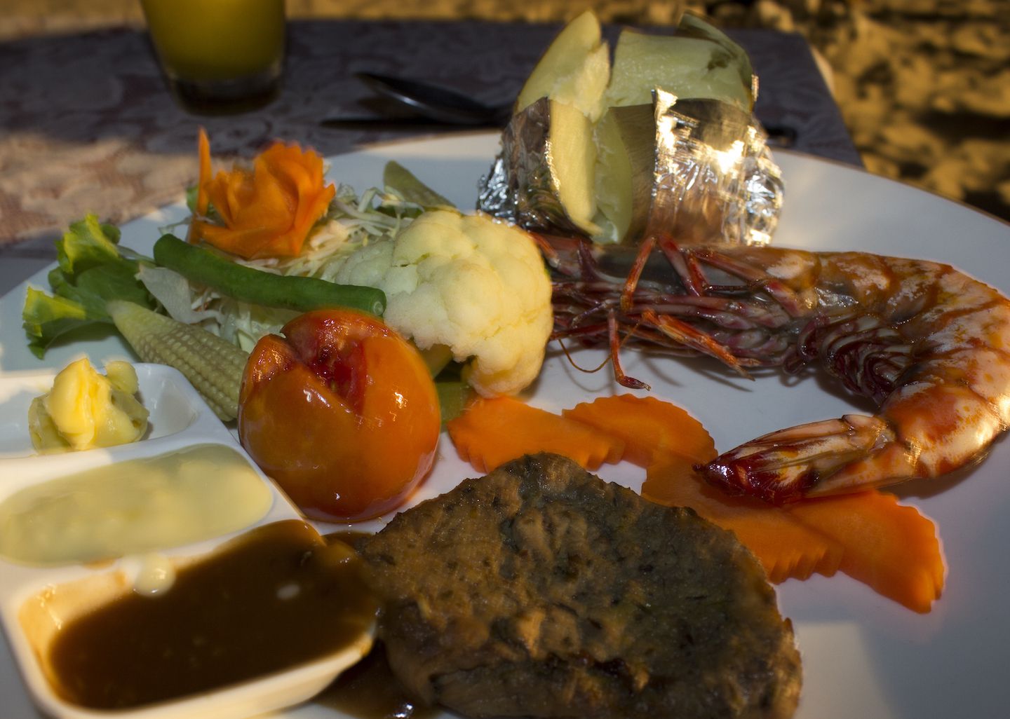 Jumbo prawns and steak during Valentine's Day sunset dinner on Koh Muk, Thailand