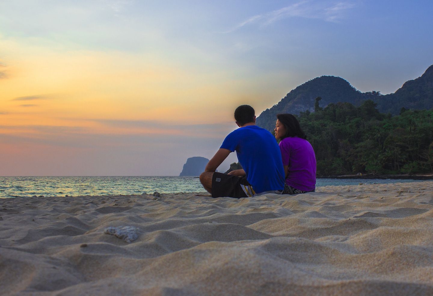 Julie and Carlos enjoying the sunset on Farang Beach, Koh Muk, Thailand