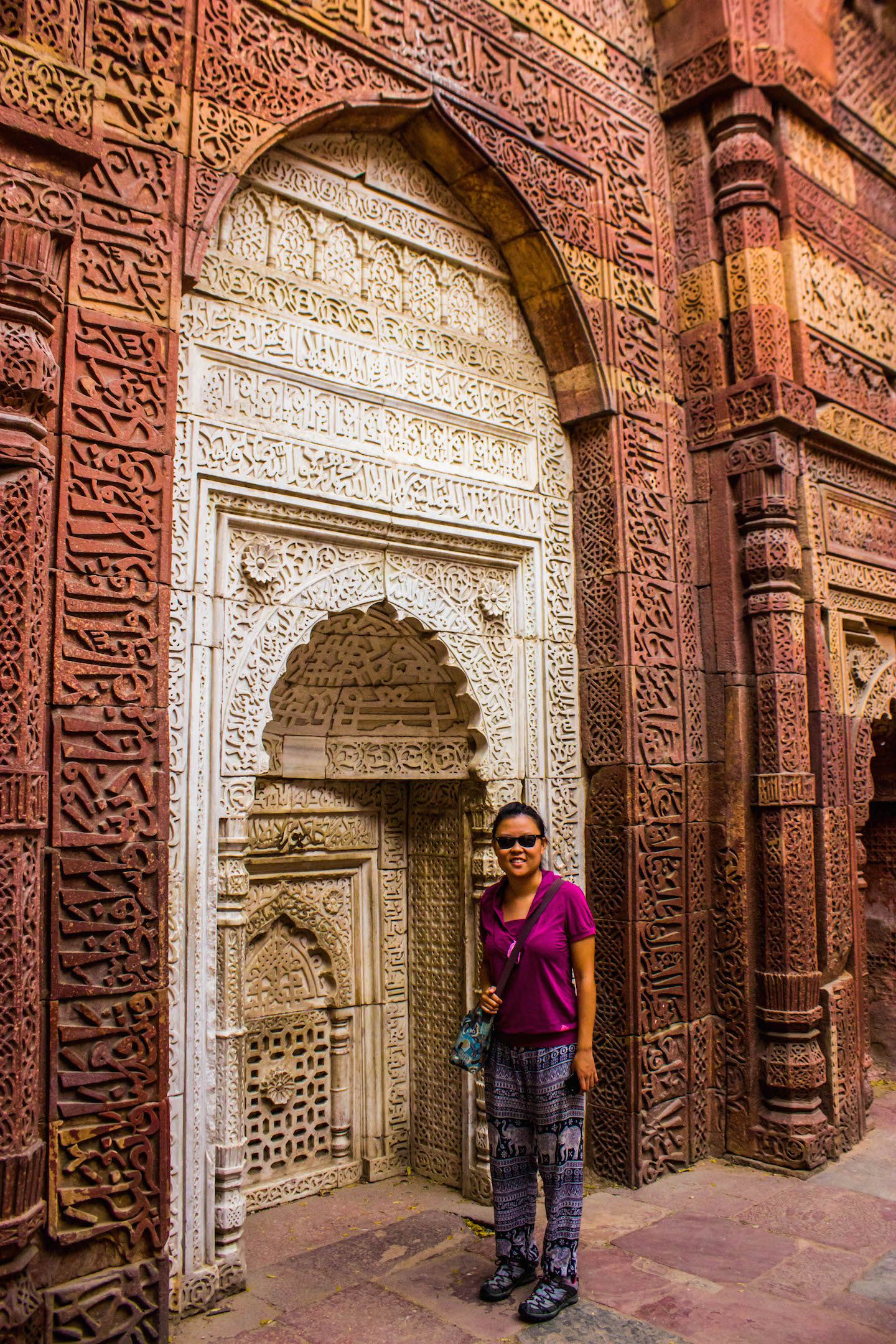 Julie and the wall carvings at Qutb Minar, New Delhi, India