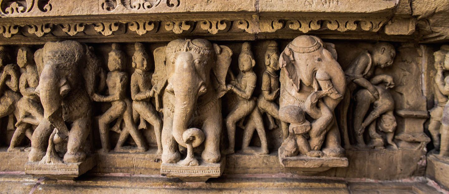 Can you tell why one of the elephants is not looking straight?, Lakshmana temple, Khajuraho, India