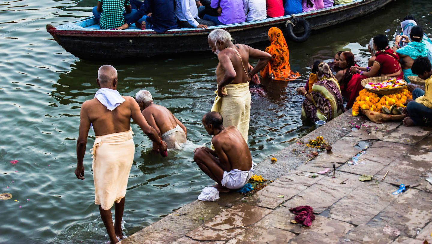 Locas bathing themselves at Dashashwamedh Ghat in Varanasi, India