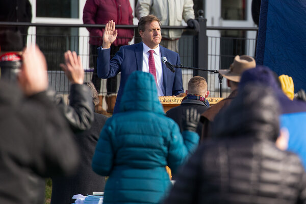Gov. Chris Sununu of New Hampshire swore in the members of the New Hampshire House of Representatives outdoors on Dec. 2 for pandemic safety reasons. He urged residents on Tuesday not to let their guard down yet.