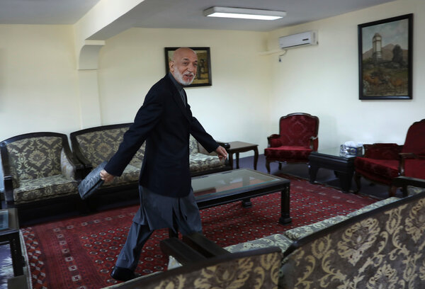 Former President Hamid Karzai leaving after an interview at his house in Kabul, Afghanistan, in June.