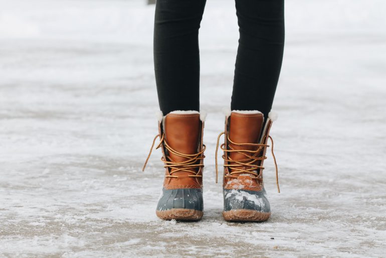 winter boots on slippery ski resort pavement