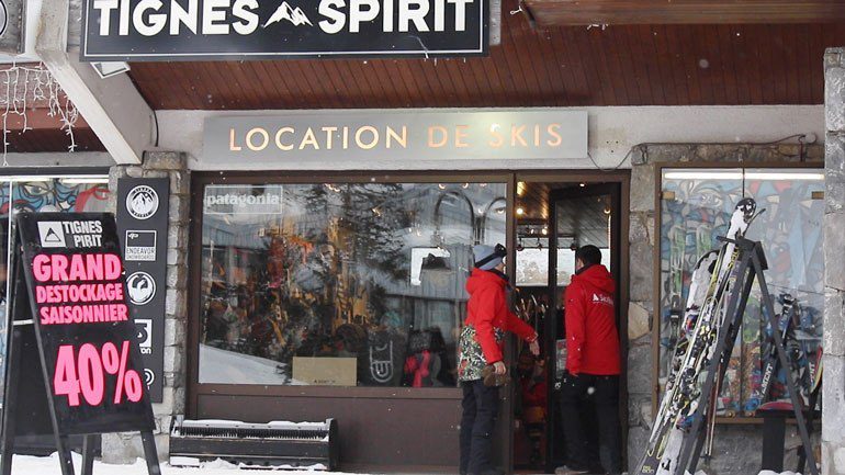 Two people entering ski shop for sales shopping
