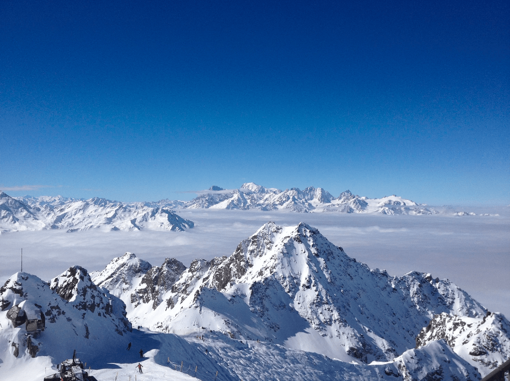 Sea of clouds behind Mont Fort mountain in Verbier Switzerland