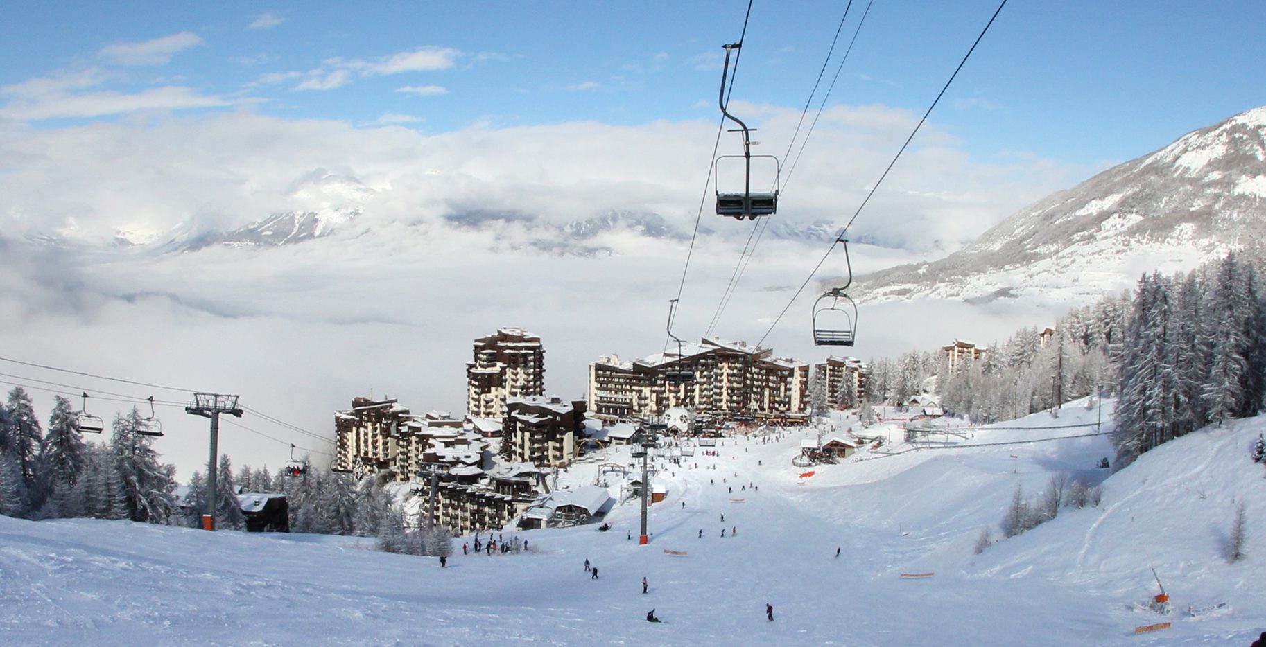 A view looking back at the village of Les Orres from a ski lift