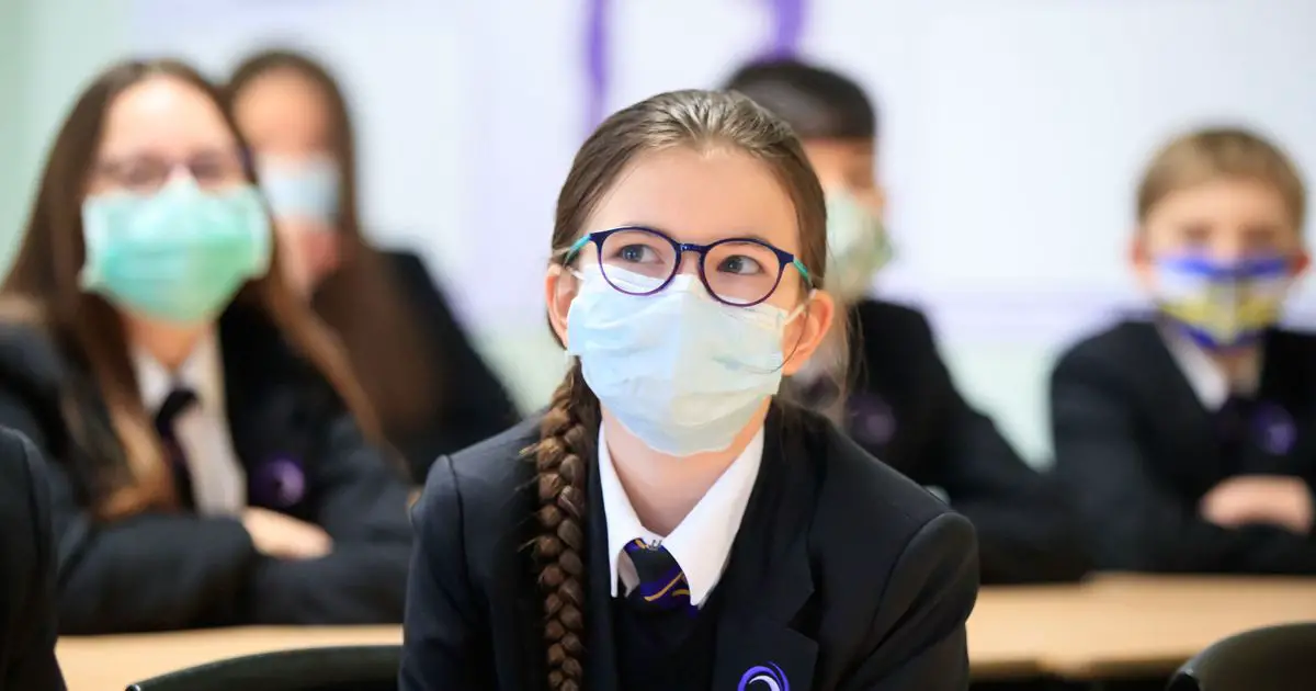 Masks return to England secondary school classrooms in bid to curb Omicron spread