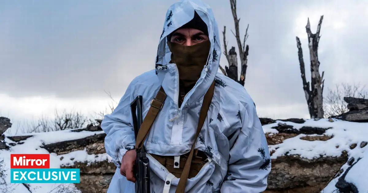 A Ukrainian soldier in a trench on the front line in Pisky