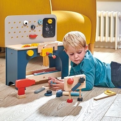 boy with wooden play tool bench by tender leaf toys TL8562