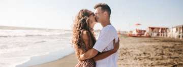 Couple Hugging on The Beach Facebook Banner