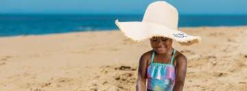 Cute Girl on The Beach Playing with Sand Facebook Banner
