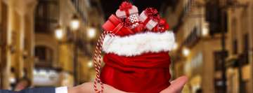 Miniature Santa Claus Gift Bag Facebook Banner