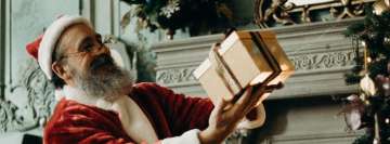 Santa Claus Secretly Giving Christmas Gifts Facebook Banner