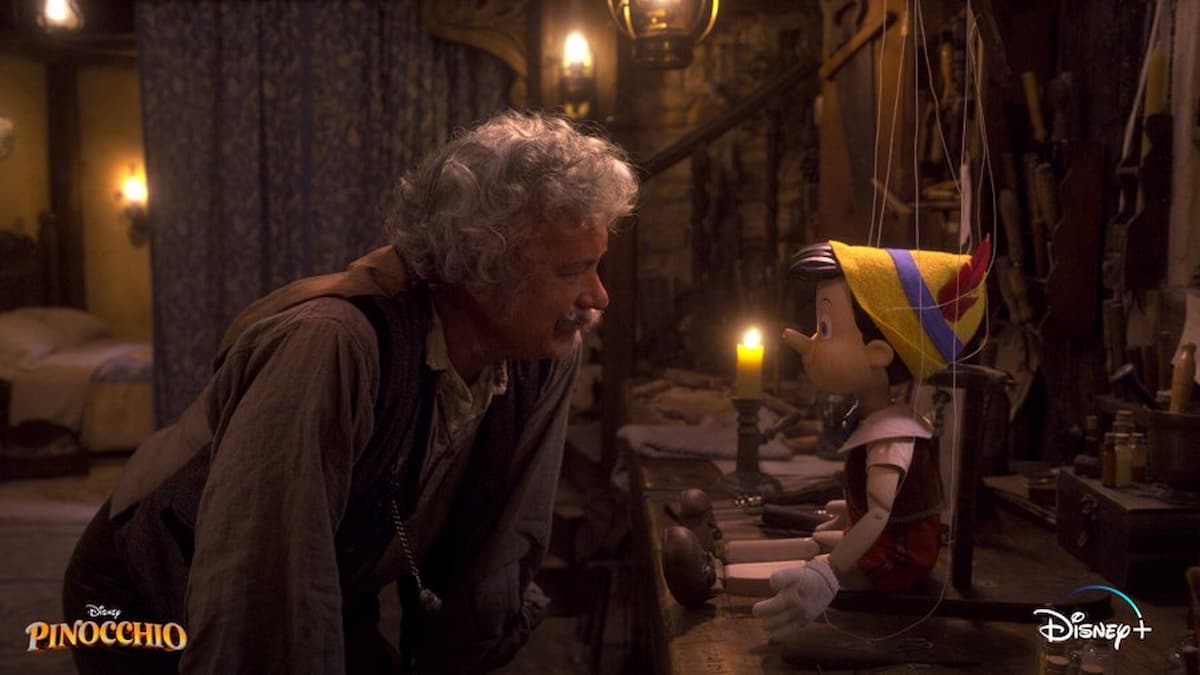 Geppetto (Tom Hanks) looks at his inanimate puppet Pinocchio