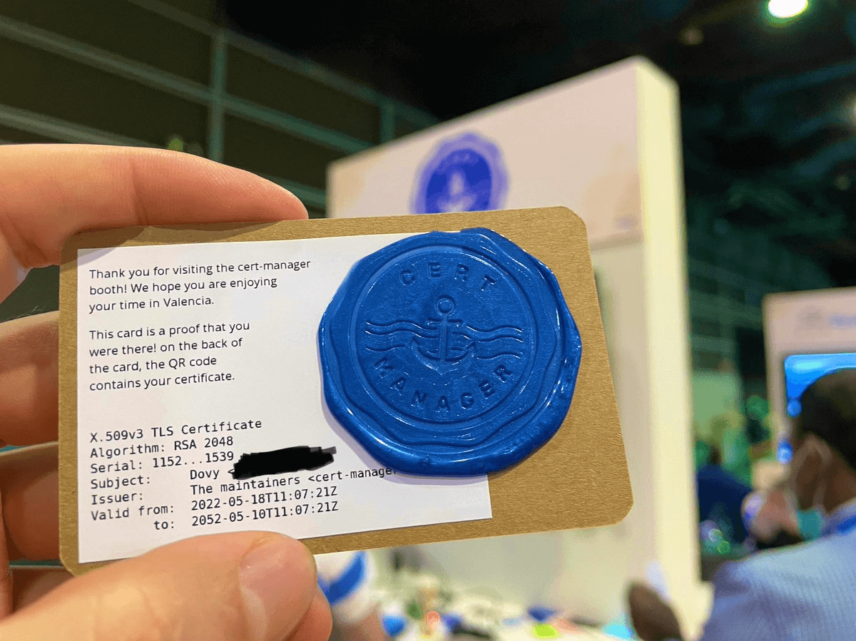 Dovy came to the cert-manager booth and took a picture of the card on which a stamp of the cert-manager project is visible, as well as the label showing their X.509 certificate. All credits for this photo go to Dovy who shared this picture on Twitter at https://twitter.com/ddovys/status/1526890240568344576.