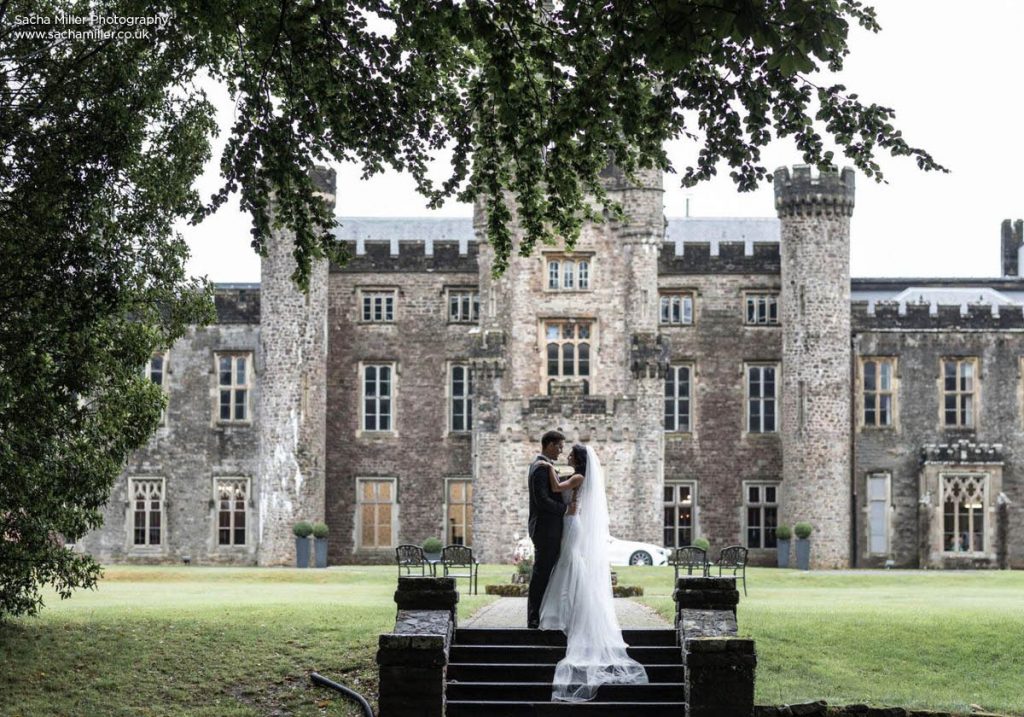 Bride and groom outside Hensol Castle - photo credit Sacha Miller photography
