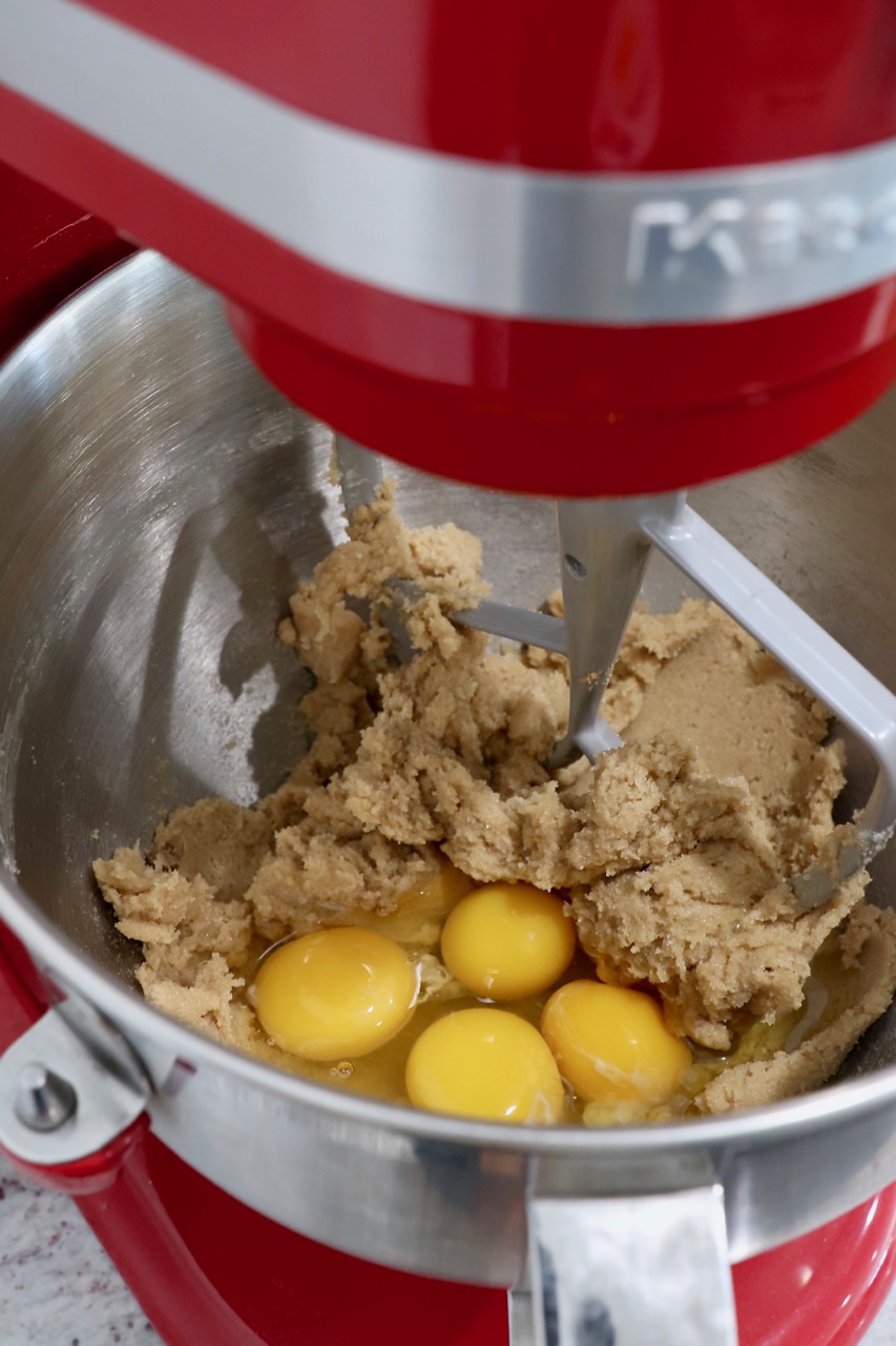cupcake dough in stand mixer with raw eggs
