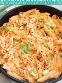 Penne pasta in cheesy buffalo chicken sauce in pan