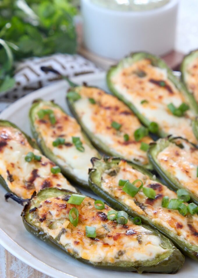cheese stuffed grilled jalapenos on plate