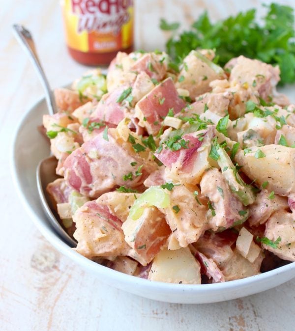 Traditional potato salad is given a spicy twist with the addition of buffalo sauce in this vegetarian and gluten free buffalo potato salad recipe!