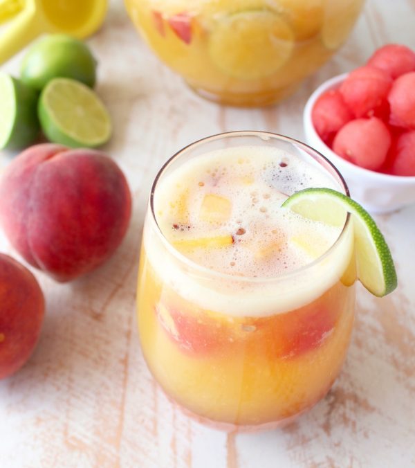 This white peach sangria is the perfect summer cocktail recipe combining refreshing white wine with fresh peaches, nectarines and lime juice!