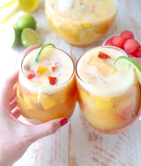 This white peach sangria is the perfect summer cocktail recipe combining refreshing white wine with fresh peaches, nectarines and lime juice!