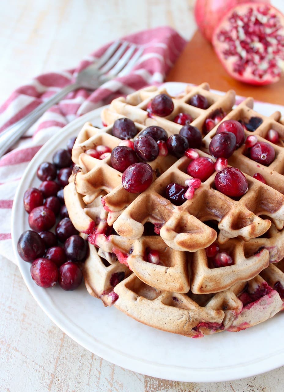 Fresh cranberries & pomegranates add a delicious burst of tartness & sweetness to this easy waffles recipe, perfect for fall breakfast or holiday brunch!