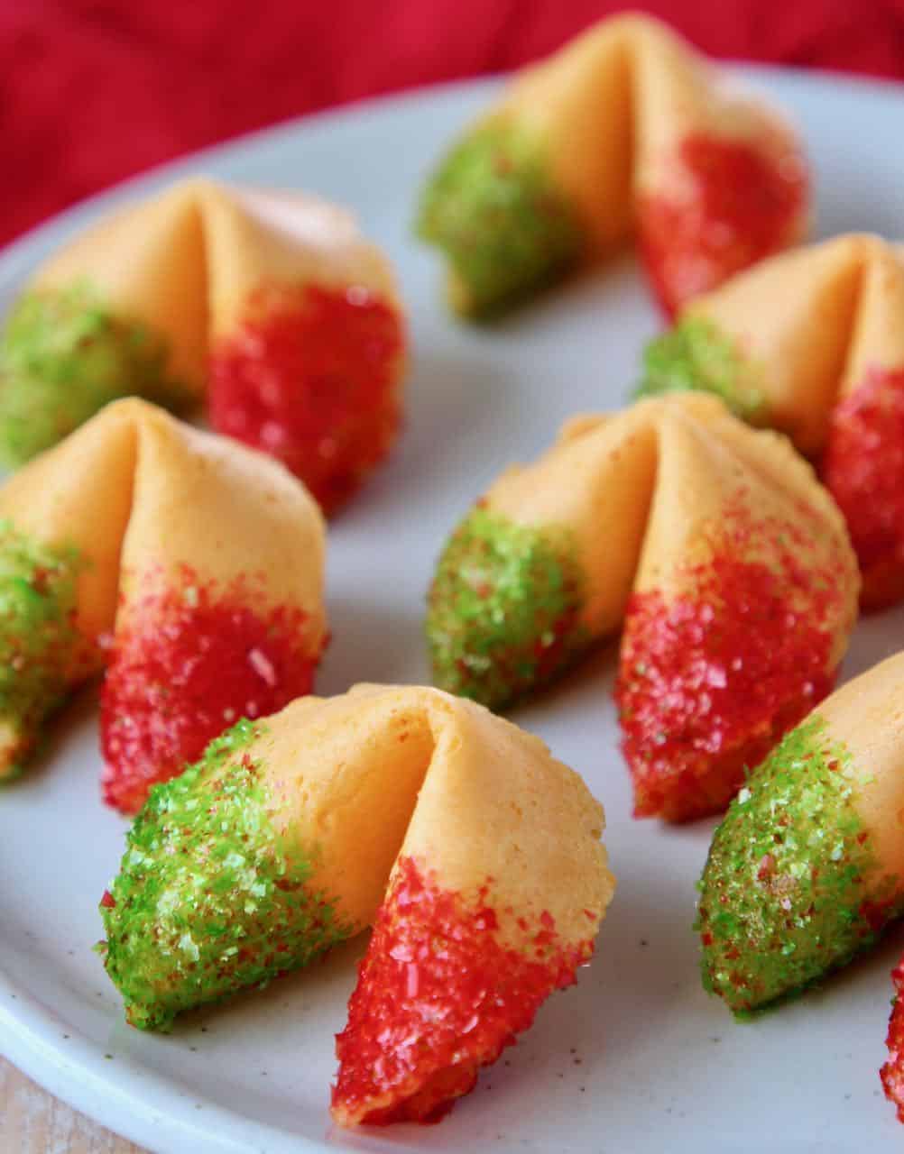 Fortune cookies with red and green glitter on plate