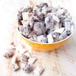 Chocolate is melted over rice chex cereal with Nutella hazelnut spread, then tossed with powdered sugar for delicious, gluten free Nutella Buddies!
