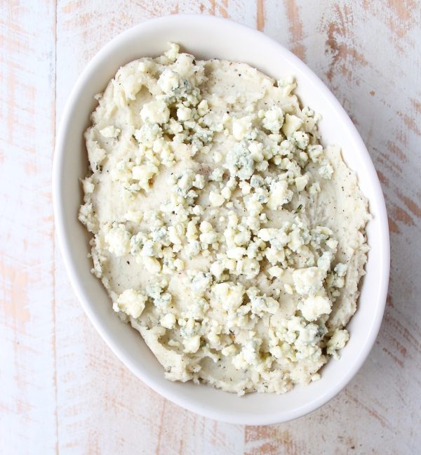 Warm rosemary herb infused butter is added to these blue cheese mashed potatoes for the best potato side dish you'll ever have in your life!