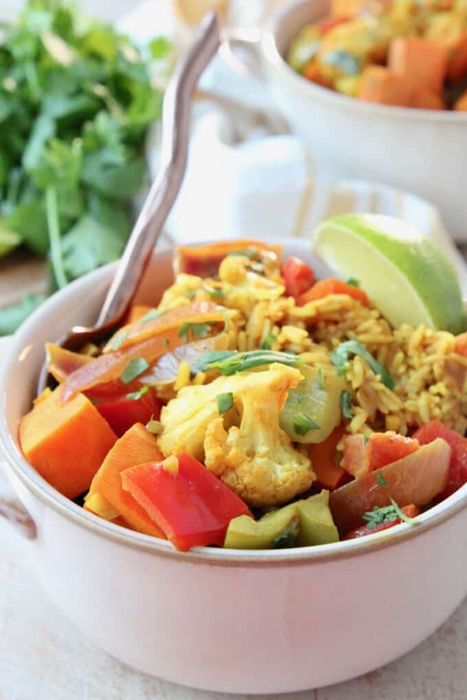 Vegetables and rice with curry sauce in bowl
