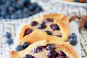 blueberry pastry on cutting board with text overlay "blueberry pastry recipe, quick & easy, made in 22 minutes with 6 ingredients!"