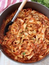 Large pot filled with pasta and meat sauce