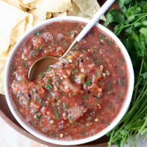 fresh tomato salsa in bowl with spoon