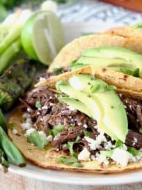 Slow Cooker Shredded Beef Barbacoa Tacos with Avocado, Cotija Cheese and Cilantro