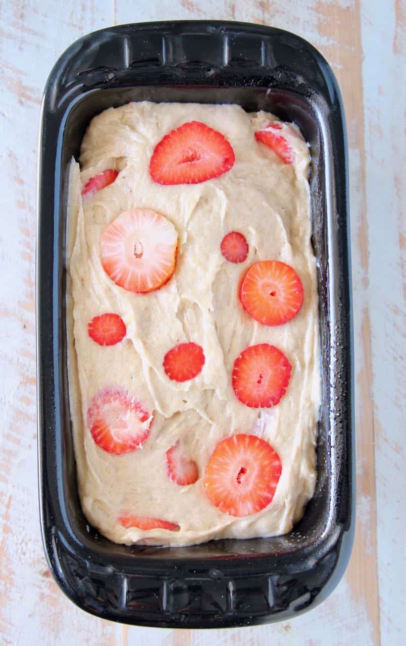 Strawberry banana bread dough in loaf pan