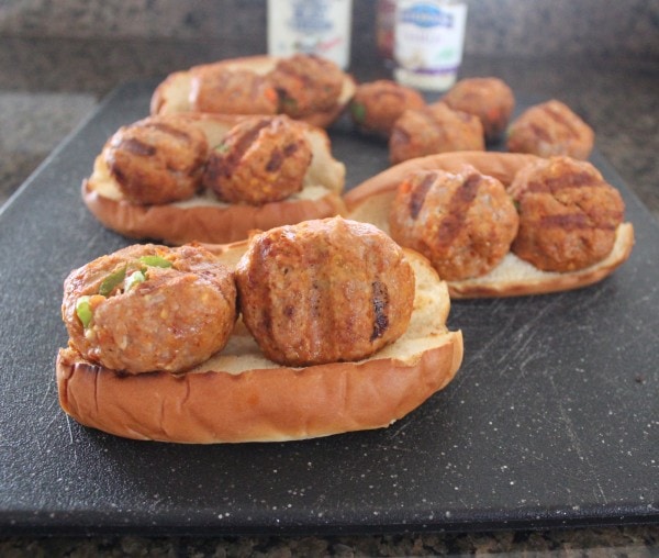 Grilled Buffalo Turkey Meatballs on a hot dog bun