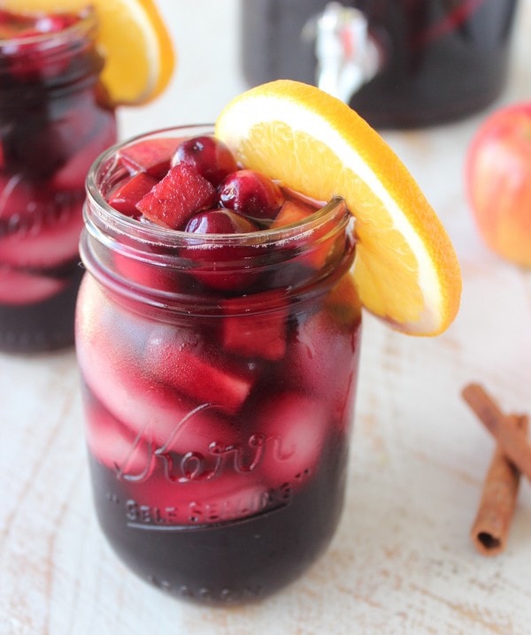 Cranberries and apples give this delicious sangria recipe tons of great fall flavors, mix up a pitcher to celebrate the holidays with friends and family!