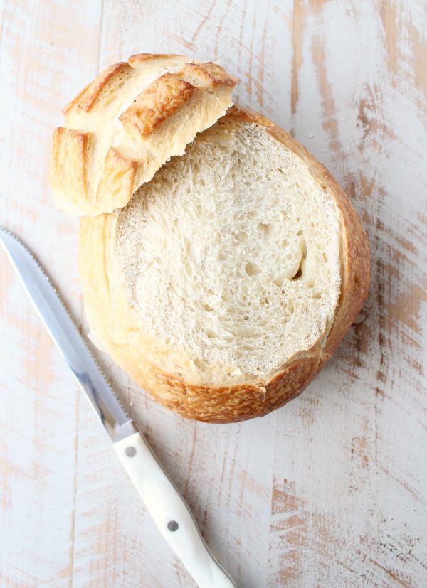 round sourdough bread with serrated knife