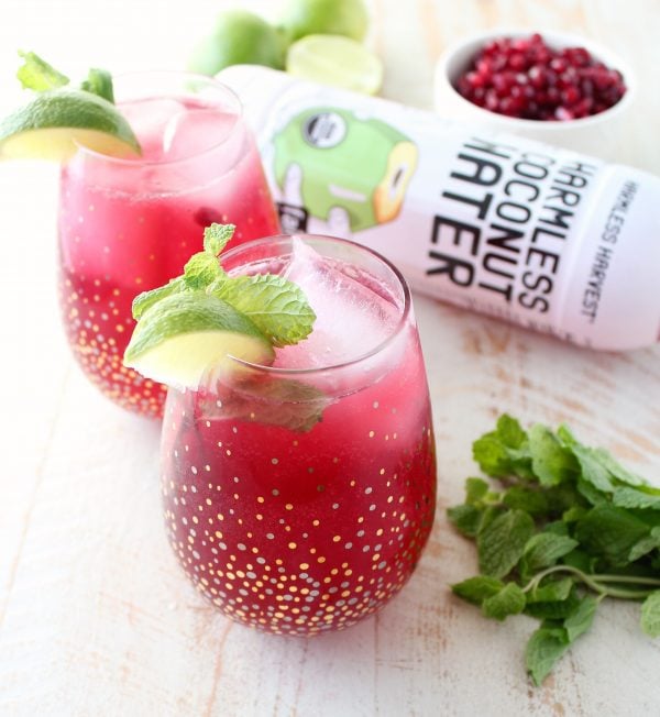 Sparkling pomegranate soda & coconut water are added to this mojito punch recipe, perfect for celebrating everything from holiday parties to Summer BBQ's!