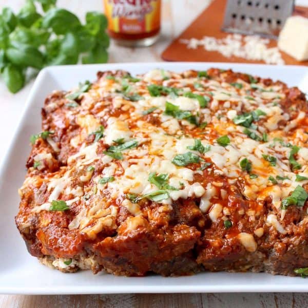 Buffalo sauce, ground beef, pork sausage and two cheeses are combined in this delicious, easy Buffalo Cheesy Meatloaf recipe!