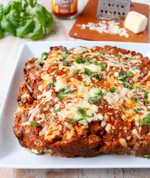 Buffalo sauce, ground beef, pork sausage and two cheeses are combined in this delicious, easy Buffalo Cheesy Meatloaf recipe!