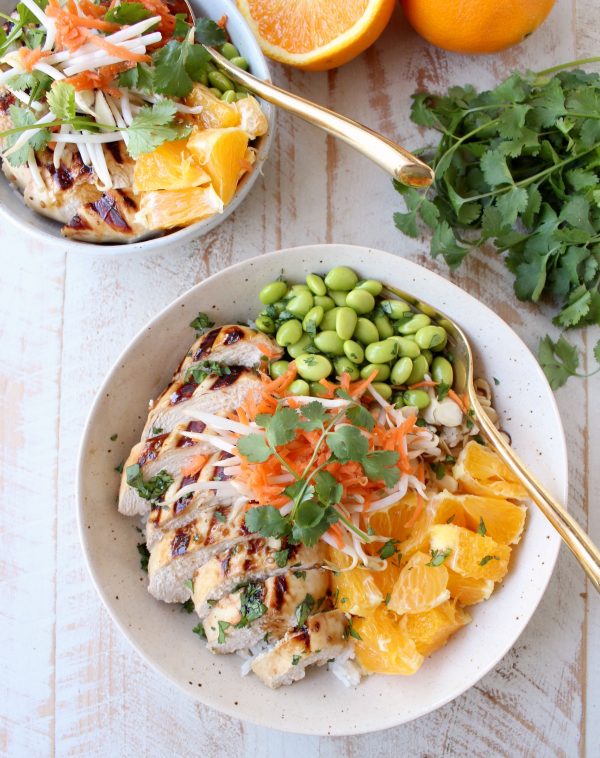 Sesame ginger marinated & grilled chicken tops these Healthy Asian Chicken Rice Bowls filled with oranges, almonds, veggies & tons of flavor!