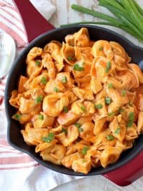 Buffalo chicken and cheese tortellini are cooked in one pot in a cheesy buffalo sauce for a seriously delicious meal made in only 20 minutes!